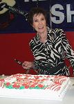 Cutting an Opry anniversary cake at the Ernest Tubb Record Shop before the Midnite Jamboree